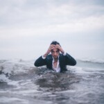 man on body of water during daytime